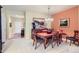 Elegant dining area with a classic table set, hardwood floors, and stylish decor creates a warm and inviting space at 16494 Aliante Dr, Broomfield, CO 80023