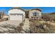 Charming one story home with stone accents, landscaped front yard, and a two car garage at 16494 Aliante Dr, Broomfield, CO 80023