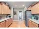 Kitchen features wooden cabinets, stainless steel appliances and hardwood flooring at 16494 Aliante Dr, Broomfield, CO 80023