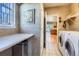 Well-lit laundry room with tiled floors and modern appliances at 16494 Aliante Dr, Broomfield, CO 80023