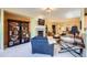 Comfortable living area with a fireplace, built-in shelving, and an open layout ideal for entertaining at 16494 Aliante Dr, Broomfield, CO 80023