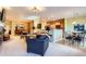 Spacious living area with a breakfast nook, open to the kitchen, dining room, and features comfortable furnishings at 16494 Aliante Dr, Broomfield, CO 80023