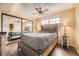 Comfortable bedroom with a ceiling fan, wood floors, and closet with mirrored doors at 814 S Vance St # F, Lakewood, CO 80226