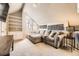 Comfortable bonus room with a unique architectural window and neutral carpet at 814 S Vance St # F, Lakewood, CO 80226
