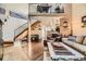 Inviting living room featuring a loft area, wood floors, and natural light at 814 S Vance St # F, Lakewood, CO 80226