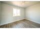 Cozy bedroom with ample natural light and modern flooring at 6671 Oneida St, Commerce City, CO 80022