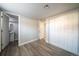 This bedroom features hardwood floors, white walls, and a closet at 6671 Oneida St, Commerce City, CO 80022