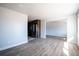 Open-concept living room and kitchen with modern flooring offers an airy feel for entertaining and relaxation at 6671 Oneida St, Commerce City, CO 80022