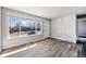 Bright living room with natural light and sleek, modern flooring at 6671 Oneida St, Commerce City, CO 80022