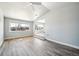 Inviting living room featuring expansive windows and sleek flooring at 6671 Oneida St, Commerce City, CO 80022