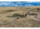 Aerial view featuring a home, barn, and vast property with a deck, creating a perfect oasis for relaxation and privacy at 11549 Haskell Creek Rd, Larkspur, CO 80118