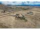 Aerial view of the property, highlighting the house, land, surrounding mountains, and countryside at 11549 Haskell Creek Rd, Larkspur, CO 80118