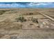 Aerial shot showcases the home and barn with acreage at 11549 Haskell Creek Rd, Larkspur, CO 80118
