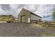 This view of the barn exterior shows its paint, architecture and construction at 11549 Haskell Creek Rd, Larkspur, CO 80118