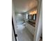 Bathroom featuring dual vanity, large soaking tub, and decorative tile floor at 11549 Haskell Creek Rd, Larkspur, CO 80118