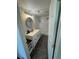 Modern bathroom featuring a single sink vanity with quartz countertop and a walk-in shower at 11549 Haskell Creek Rd, Larkspur, CO 80118