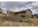 View of home with play structure, and attached garage and lovely exterior features at 11549 Haskell Creek Rd, Larkspur, CO 80118