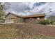 Charming home featuring an inviting porch and a well-manicured front yard at 11549 Haskell Creek Rd, Larkspur, CO 80118