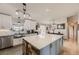 Bright, modern kitchen featuring a spacious island, stylish fixtures, and updated appliances at 11549 Haskell Creek Rd, Larkspur, CO 80118