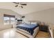Spacious main bedroom with large windows offering scenic views and a comfortable desk area at 11549 Haskell Creek Rd, Larkspur, CO 80118