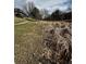 Exterior view of a grassy landscape with a walking path and multi-story residential buildings in the distance at 230 E Highline Cir # 304, Centennial, CO 80122