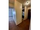 Hallway transitioning into kitchen area with white walls, highlighting the home's transition layout at 230 E Highline Cir # 304, Centennial, CO 80122