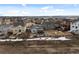 An elevated view of a community featuring many homes with spacious backyard, fences and walkways at 15271 Grasslands Dr, Parker, CO 80134