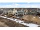 An overhead shot of a community featuring many homes with spacious backyard, fences and walkways at 15271 Grasslands Dr, Parker, CO 80134