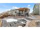 Relaxing backyard with a covered patio and stone pathway, perfect for enjoying the outdoors at 15271 Grasslands Dr, Parker, CO 80134