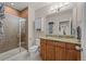 Updated bathroom featuring granite counters, tiled walk-in shower, and neutral tile flooring at 15271 Grasslands Dr, Parker, CO 80134