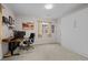 Neutral bedroom with a wall of storage, a modern desk, and a bright window at 15271 Grasslands Dr, Parker, CO 80134