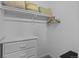 Bright closet with built in shelves and drawers for easy organization at 15271 Grasslands Dr, Parker, CO 80134