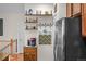 Kitchen details include coffee station with stainless steel fridge and open shelving at 15271 Grasslands Dr, Parker, CO 80134