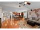 Spacious living room showcases hardwood floors, an open layout, and a seamless transition to the kitchen at 15271 Grasslands Dr, Parker, CO 80134