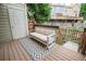 Cozy backyard deck featuring an outdoor sofa and access to additional fenced yard at 1699 S Trenton St # 69, Denver, CO 80231