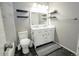 Beautiful bathroom featuring a double vanity, marble tile, and decorative floating shelves at 1699 S Trenton St # 69, Denver, CO 80231