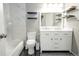 Charming bathroom featuring a double vanity with marble countertops and modern lighting at 1699 S Trenton St # 69, Denver, CO 80231