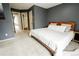 Primary bedroom with carpet, neutral paint, and ensuite bathroom at 1699 S Trenton St # 69, Denver, CO 80231