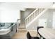 Living room with a staircase, neutral decor, and hardwood floors at 1699 S Trenton St # 69, Denver, CO 80231