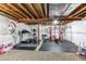 Unfinished basement with gym equipment and an exposed ceiling at 463 Mazzini St, Erie, CO 80516