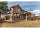 Two-story home featuring a well-maintained lawn and attached garage at 463 Mazzini St, Erie, CO 80516