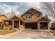 Charming two-story home with a well-maintained lawn and a three car garage at 463 Mazzini St, Erie, CO 80516