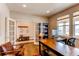 Spacious office with hardwood floors, built-ins, and a comfortable seating area at 463 Mazzini St, Erie, CO 80516