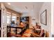 Bright office space featuring a large desk, hardwood floors, and stylish decor at 463 Mazzini St, Erie, CO 80516