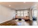 Cozy living room featuring neutral walls, hardwood flooring, and comfortable seating at 463 Mazzini St, Erie, CO 80516