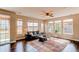 Bright and airy living room is filled with natural light from the many surrounding windows at 463 Mazzini St, Erie, CO 80516