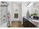 Elegant bathroom with a double vanity, shower/tub combination, and decorative accents, exuding style and functionality at 8170 Lt William Clark Rd, Parker, CO 80134