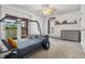 Unique bedroom featuring a custom Jeep-themed bed frame, a balcony and neutral decor at 8170 Lt William Clark Rd, Parker, CO 80134