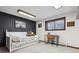 Bright bedroom featuring a desk and white-trimmed window for studying and relaxation at 8170 Lt William Clark Rd, Parker, CO 80134