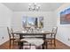 Comfortable dining room with a large picture window offering views and rustic wooden furniture at 8170 Lt William Clark Rd, Parker, CO 80134